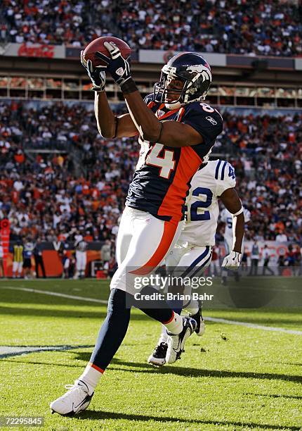 Wide receiver Javon Walker of the Denver Broncos grabs a touchdown pass against defensive back Jason David of the Indianapolis Colts in the second...