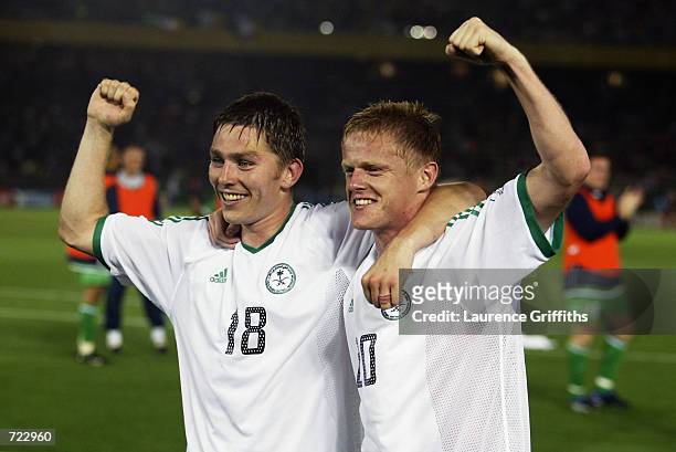 Matt Holland and Damien Duff of the Republic of Ireland celebrate victory and qualification to the next round after the FIFA World Cup Finals 2002...