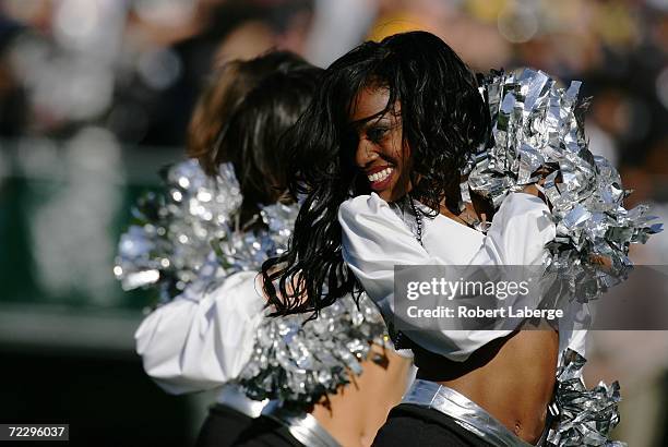 Raiderette cheerleader dances during the NFL game between the Oakland Raiders and the Pittsburgh Steelers at McAfee Coliseum October 29, 2006 in...