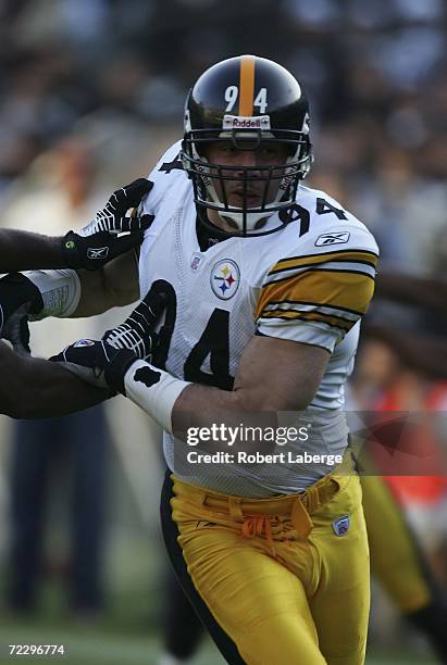 Chad Brown of the Pittsburgh Steelers tackles an Oakland Raiders player during an NFL game on October 29, 2006 at McAfee Coliseum in Oakland,...