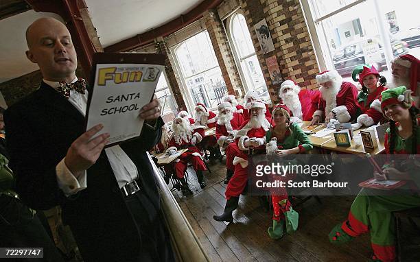 James Lovell , Director of MOF Santa School, instructs his class of Santas and Elves during the Ministry of Fun Santa School on October 30, 2006 in...