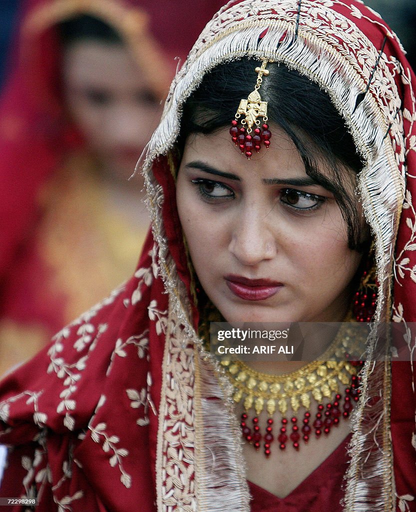 Brides Pakistani brides sit during a mass wedding ceremony of about 55... News ...