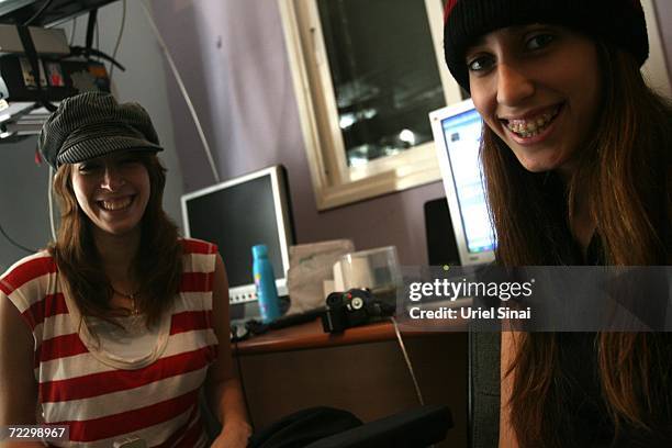 Lital "Tasha" Mizel and Adi "Dishka" Frimmerman, both 22-years-old, pose for a photo October 30, 2006 in their apartment in the central Israeli town...
