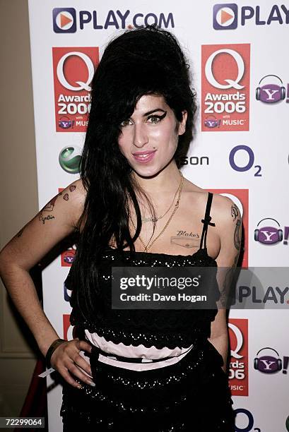 Singer Amy Winehouse poses in the awards room at the Q Awards 2006 at Grosvenor House Hotel on October 30, 2006 in London, England.