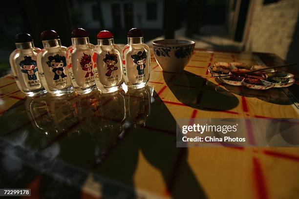 Interior painting artworks of snuff bottles made by artist Li Junyu are displayed at his workshop October 30, 2006 in Xian of Shaanxi Province,...