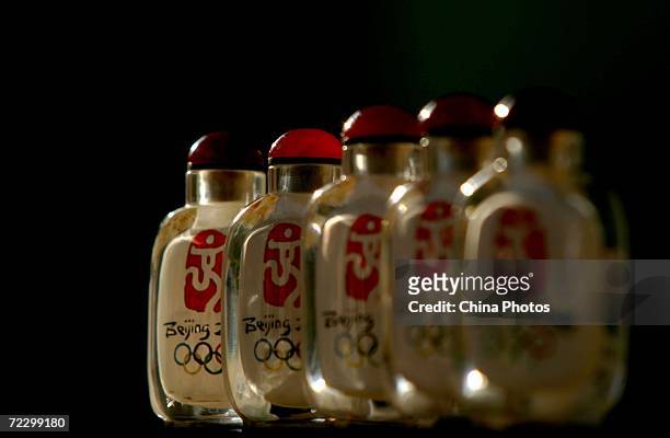 Interior painting artworks of snuff bottles made by artist Li Junyu are displayed at his workshop October 30, 2006 in Xian of Shaanxi Province,...