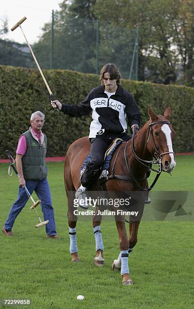 Tennis player Tommy Robredo of Spain takes some time out to play Polo during day one of the BNP Paribas ATP Tennis Masters Series at the Palais...