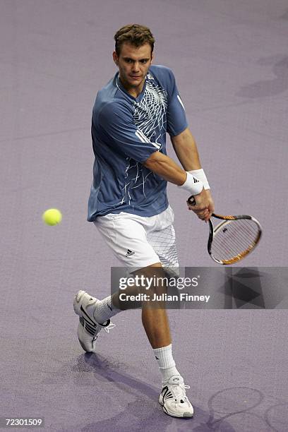 Paul-Henri Mathieu of France plays a backhand in his match against Andreas Seppi of Italy during day one of the BNP Paribas ATP Tennis Masters Series...