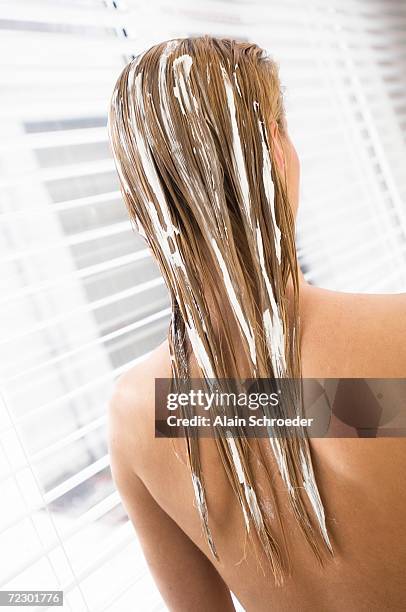 young woman with hair mask, view from the back, close up (studio) - wet hair back stock pictures, royalty-free photos & images