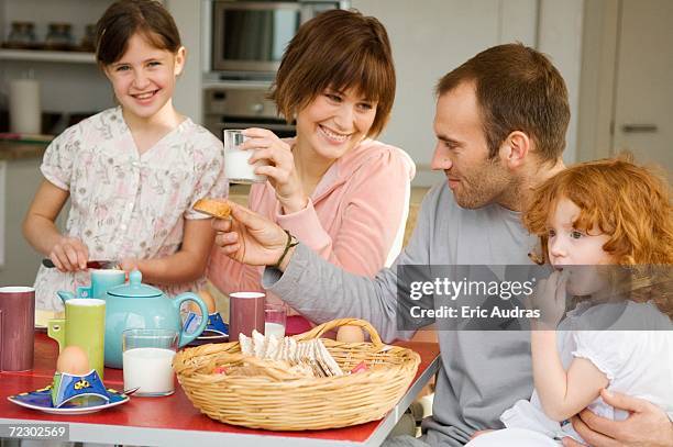 couple and 2 little girls having breakfast - kid boiled egg stock pictures, royalty-free photos & images