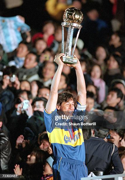Jorge Bermudez Captain of Boca Juniors lifts the trophy after the victory over Real Madrid in the Toyota Intercontinental Cup in the National...