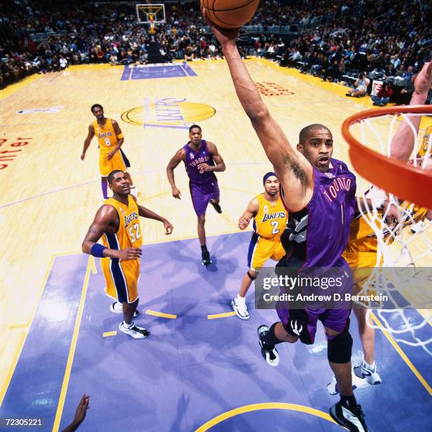 Vince Carter of the Toronto Raptors goes up for a slam dunk against the Los Angeles Lakers during the NBA game at the Staples Center in Los Angeles,...