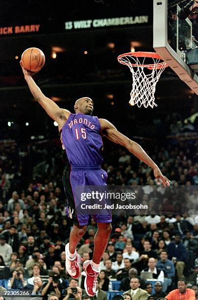 Vince Carter of the Toronto Raptors jumps to make the slam dunk during the NBA Allstar Game Slam Dunk Contest at the Oakland Coliseum in Oakland,...