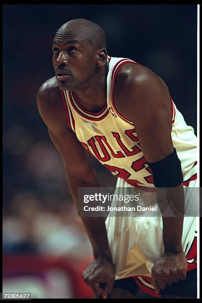 Guard Michael Jordan of the Chicago Bulls watches a free throw attempt at the United Center in Chicago, Illinois, during the game against the Seattle...