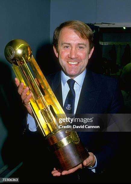 Everton manager Howard Kendall holds the Canon League Division One trophy after the match against West Ham United at Goodison Park in Liverpool,...