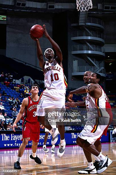 Jimmie Hunter of the Huntsville Flight drives to the basket for a layup against the Fayetteville Patriots at the Crown Coliseum in Fayetteville,...