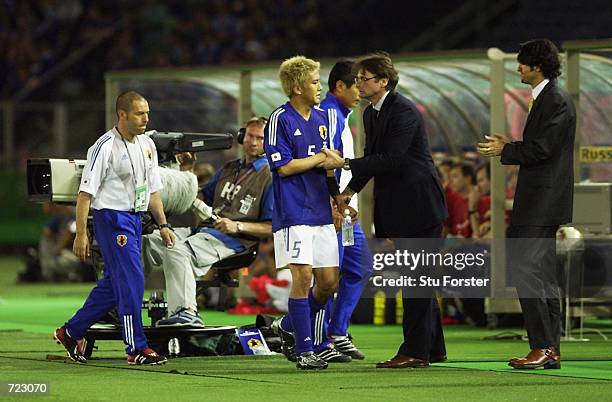 Japan coach Philippe Troussier congratulates goalscorer Junichi Inamoto after he scored the winning goal during the FIFA World Cup Finals 2002 Group...