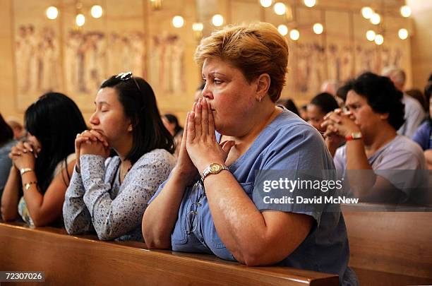 Beatrice Ochoa prays April 1, 2005 during a Mass led by Roman Catholic Cardinal Roger Mahony for the health of Pope John Paul II at the Cathedral of...