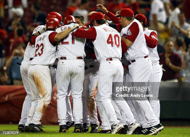 The Cincinnati Reds celebrate the game-winning 10th inning single by D'Angelo Jimenez for a 4-3 win over the Colorado Rockies on May 19, 2004 at...