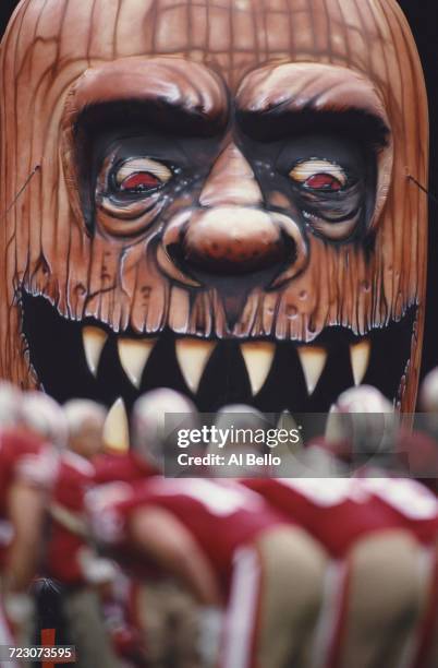 San Francisco 49ers players huddle beneath a halloween monster statue during their NFC West football game against the New Orleans Saints on 29...