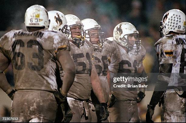 Members of the Wyoming Cowboys look on during a game against the Colorado State Rams at the Hughes Stadium in Ft. Collins, Colorado. The Cowboys...