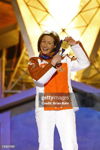 Claudia Pechstein of Germany shows off her gold medal from the Ladies 5000m Speed Skating during the Medals Ceremony at Medals Plaza during the 2002...