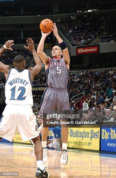 Jason Kidd of the New Jersey Nets shoots over Chris Whitney of the Washington Wizards during their game at MCI Center in Washington, D.C.. The Nets...