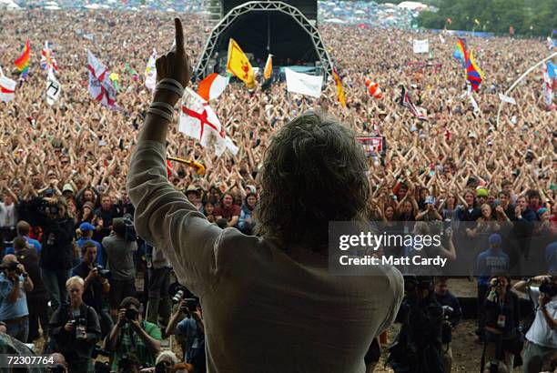 Sir Bob Geldof, LIVE 8 organiser, invites the festival crowd to link hands in support of the Make Poverty History campaign, on the second day of the...