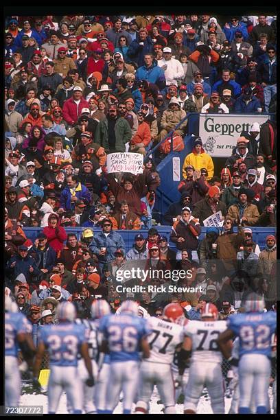 Fans cheer during a game between the Cleveland Browns and the Houston Oilers at Cleveland Stadium in Cleveland, Ohio. The Oilers won the game, 37-10....