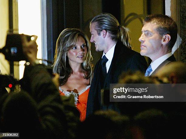 Real Madrid soccer player David Beckham and his wife, Victoria Beckham, meet the media as they leave Claridges Hotel April 12, 2004 in London,...