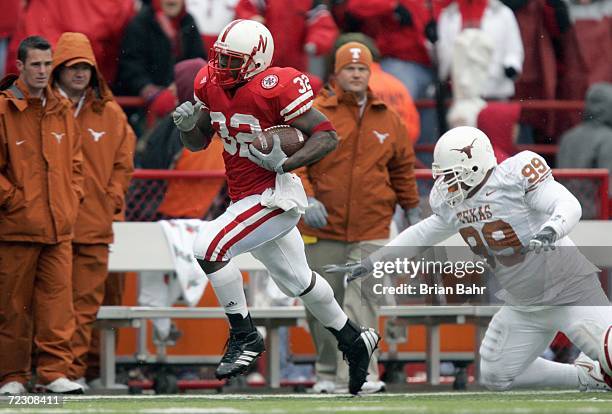 Brandon Jackson of the Nebraska Cornhuskers carries the ball against Roy Miller of the Texas Longhorns on October 21, 2006 at Memorial Stadium in...