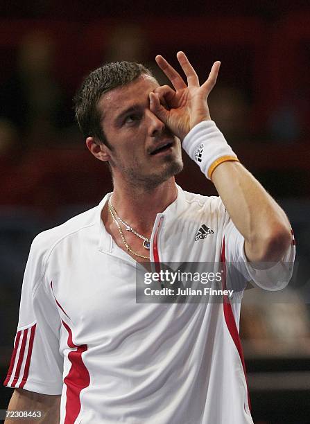 Marat Safin of Russia misjudges a line call as he looks up at hawkeye in his match against Nicolas Mahut of France during day one of the BNP Paribas...