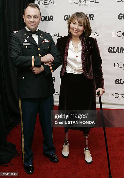 New York, UNITED STATES: Iraq War veteran and Democratic US Congressional candidate Tammy Duckworth and her husband Bryan Bowlsbey arrive 30 October...