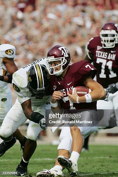 Quarterback Stephen McGee of the Texas A&M Aggies gets hit by linebacker Dedrick Harrington of the Missouri Tigers at Kyle Field on October 14, 2006...
