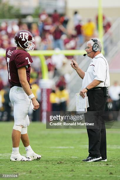 Head coach Dennis Franchione talks to quarterback Stephen McGee of the Texas A&M Aggies against the Missouri Tigers at Kyle Field on October 14, 2006...