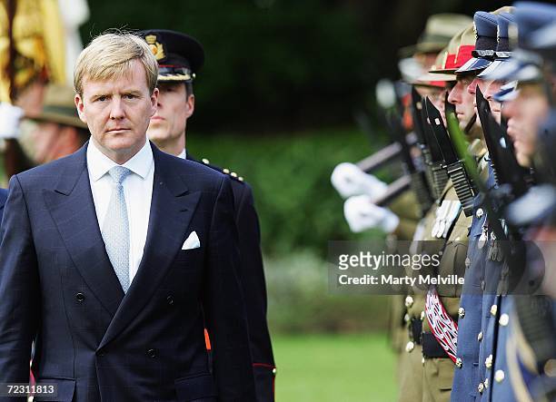 His Royal Highness The Prince of Orange of The Netherlands inspects the tri guard of honour during a welcome at Government House on the ninth day of...