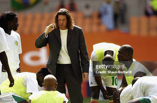 Senegal coach Bruno Metsu briefs his team before the Group A match against Denmark of the World Cup Group Stage played at the Daegu World Cup...