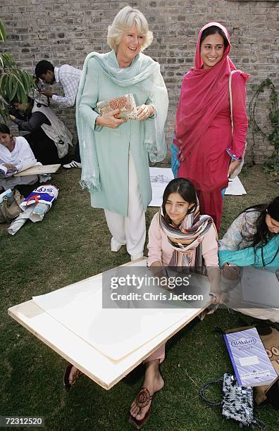 Camilla, Duchess of Cornwall talks to pupils in the art class at Fatima Jinnah college of the third day of the Royal Tour of Pakistan on October 31,...