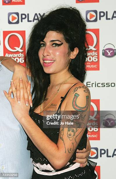 Singer Amy Winehouse poses in the Awards Room at the Q Awards 2006 held at the Grosvenor House Hotel on October 30, 2006 in London, England.