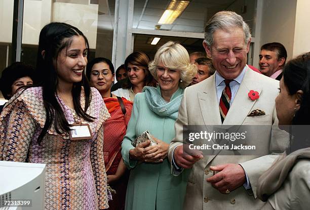 Camilla, Duchess of Cornwall and Charles, Prince of Wales talks to a pupil in the computer class at Fatima Jinnah college on the third day of the...