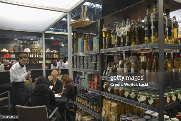People eat at "Globus Gurmond" at the Moscow exhibition hall during the Millionaire Fair, October 28, 2006 in Moscow, Russia. Private wealth was...
