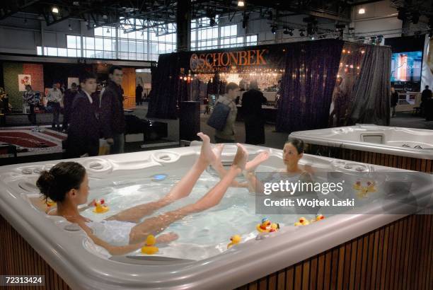 Women sit in a jacuzzi at the Moscow exhibition hall during the Millionaire Fair, October 28, 2006 in Moscow, Russia. Private wealth was banned under...