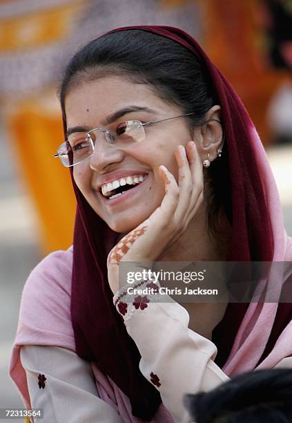 Pupil laughs as she relaxs at Fatima Jinnah Womens University on the third day of the Royal Tour of Pakistan on October 31, 2006 in Islamabad,...