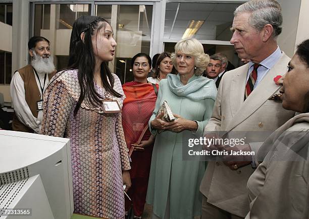 Camilla, Duchess of Cornwall and Charles, Prince of Wales talk to a pupil in the computer class at Fatima Jinnah womens University on the third day...