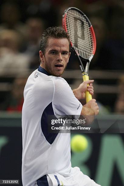 Xavier Malisse of Belgium prepares to play a backhand in his match against Sebastien Grosjean of France during day two of the BNP Paribas ATP Tennis...