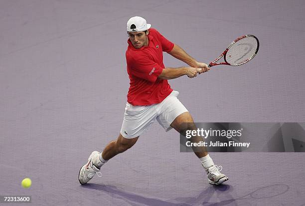 Sebastien Grosjean of France prepares to play a backhand in his match against Xavier Malisse of Belgium during day two of the BNP Paribas ATP Tennis...