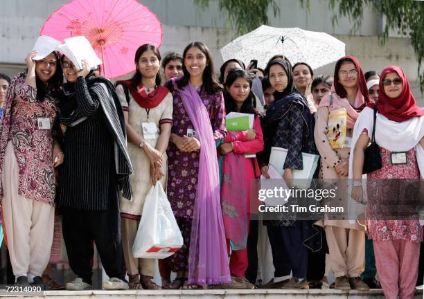 Students at the all female Fatima Jinnah University await the arrival of Prince Charles and the Duchess of Cornwall on October 31, 2006 in...