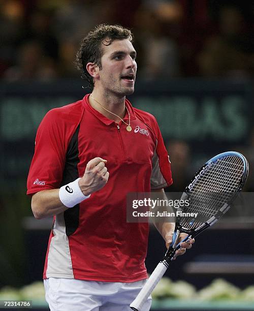 Julien Benneteau of France celebrates winning a point in his match against Fabrice Santoro of France during day two of the BNP Paribas ATP Tennis...