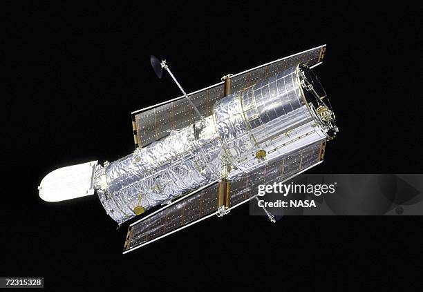 In this handout from the National Aeronautical Space Administration , the Hubble Space Telescope drifts through space in a picture taken from the...