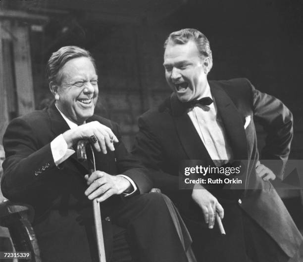 American motion picture director Robert Z. Leonard and comic film actor Red Skelton share a laugh together backstage, 1950s.